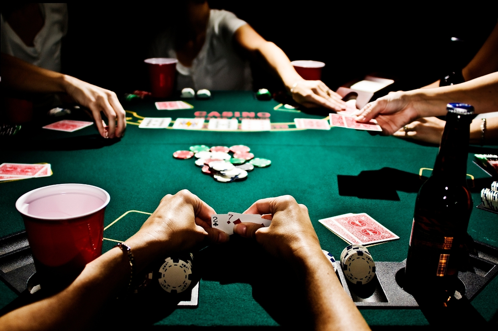 People playing blackjack cards